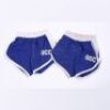 Lot # 13 - S1E17 - "Physical Education": Two Greendale Athletic Department Gym Shorts