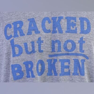 Lot # 207 - S5E03 - "Basic Intergluteal Numismatical": Two "Cracked But Not Broken" T-Shirts