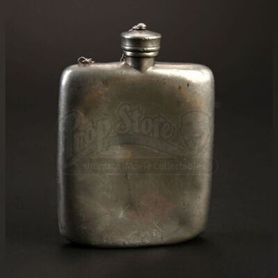 Trini "Gordo" Garcia's (Michael Pena) Flask