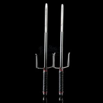 Lot # 155: Elektra Natchios' Red and Black-Handled Retractable Sais