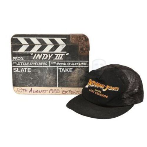 Lot #372 - INDIANA JONES AND THE LAST CRUSADE (1989) - Robert Watts Collection: Production-Used Clapperboard and Crew Cap