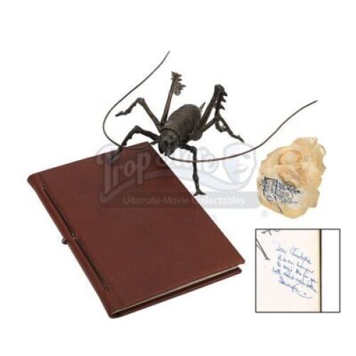 Lot #498 - THE LORD OF THE RINGS (2001-2003) - Sir Christopher Lee Estate Collection: Notebook Autographed by Peter Jackson and Cast, with Weta Bug and Promotional Ring