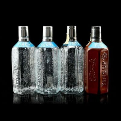 Lot # 234: MARVEL'S JESSICA JONES (TV SERIES) - Set of Four of Jessica Jones' Tin Cup Whiskey Bottles