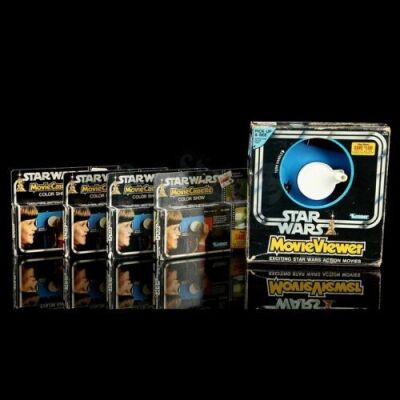 Lot # 5: Star Wars Movie Viewer with Four Movie Cassettes