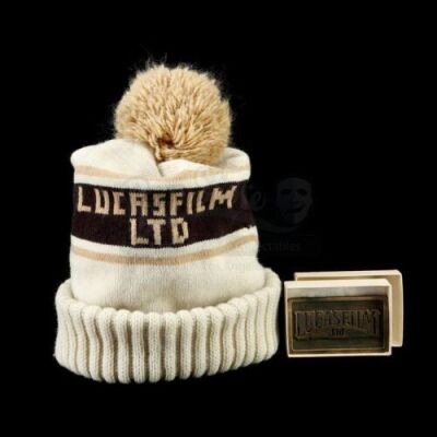 Lot # 389: Lucasfilm Ltd. Knit Beanie and Metal Paperweight