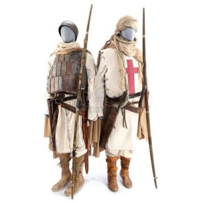 Lot # 114: ROBIN HOOD (2018) - Crusader Fight and Flashback Costumes with Weaponry"