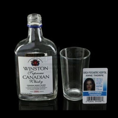 Lot # 194: Marvel's Jessica Jones (TV Series) - Jessica Jones' Whiskey Set and Hospital Badge
