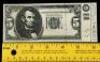 Lot #97 - BACK TO THE FUTURE PART II (1989) - Future Five Dollar Bill - 5