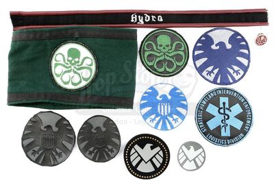 Lot #214 - Marvel's Agents of S.H.I.E.L.D. - Collection of S.H.I.E.L.D. Patches and Hydra Accessories