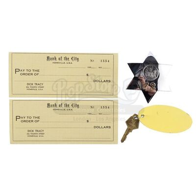 Lot # 614: DICK TRACY (1990) - Police Badge, Midway Hotel Key, and Dick Tracy's (Warren Beatty) Blank Checks