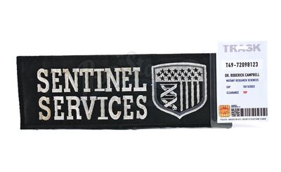 Lot # 126: The Gifted - Dr. Roderick Campbell's Trask Badge with Sentinel Services Patch