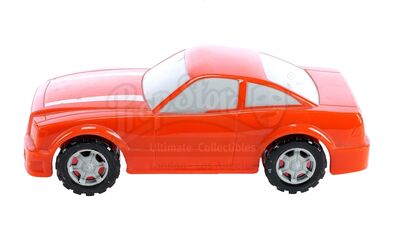 Lot # 31: Various Episodes: Orange Plastic Model Car from Blueprint Room