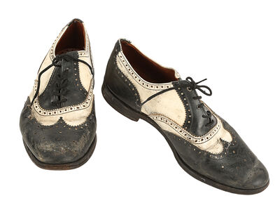 Lot #555 - EMPIRE OF THE SUN (1987) - Jim Graham's (Christian Bale) Golf Shoes