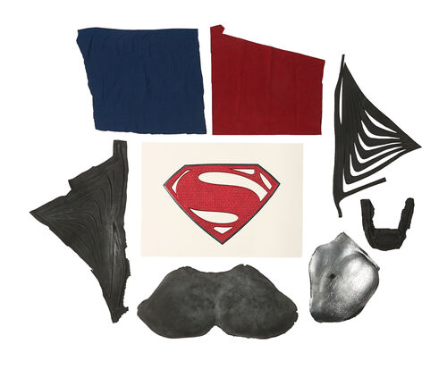 Lot #758 - MAN OF STEEL (2013) - Superman (Henry Cavill) Chest Emblem, Unfinished Belt Buckle, Suit Fabric Samples and Unpainted Rib Motifs