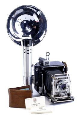 Lot # 110: Netflix's A Series of Unfortunate Events (TV Series) - Mr. Poe's Business Cards and Wallet, and Mrs. Poe's Newspaper Camera