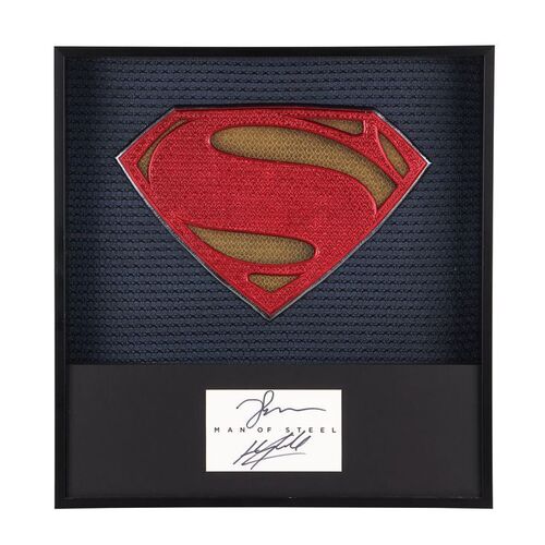 Lot # 232: Man Of Steel (2013) - Framed Promotional Superman Suit Emblem with Henry Cavill and Zack Snyder Autographs