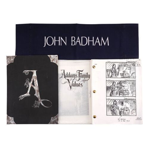 Lot # 492: The Addams Family (1991)/ Addams Family Values (1993) - Hand-Drawn Storyboard Folder, Printed Storyboards, Promotional Photos and Joke Chairback