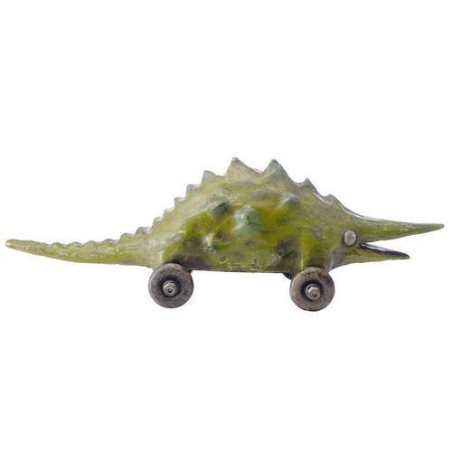 Lot # 493: The Addams Family (1991) - Wednesday Addams' (Christina Ricci) Photo-Matched Dinosaur Toy