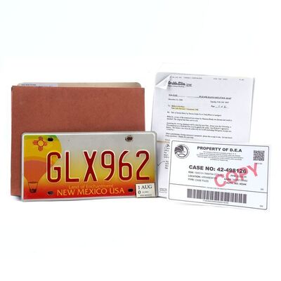 Lot # 589: Breaking Bad (T.V. Series, 2008 - 2013) - Hank Schrader's (Dean Norris) License Plate and Gale Boetticher (David Costabile) Case File