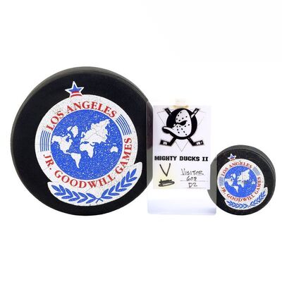 Lot # 653: D2: The Mighty Ducks (1994) - Pair of Junior Goodwill Games Hockey Pucks with I.D. Badge