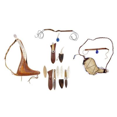 Lot # 899: The Last Airbender (2010) - Katara's (Nicola Peltz) Necklaces and Water Skin and Sokka's (Jackson Rathbone) Boomerang and Daggers