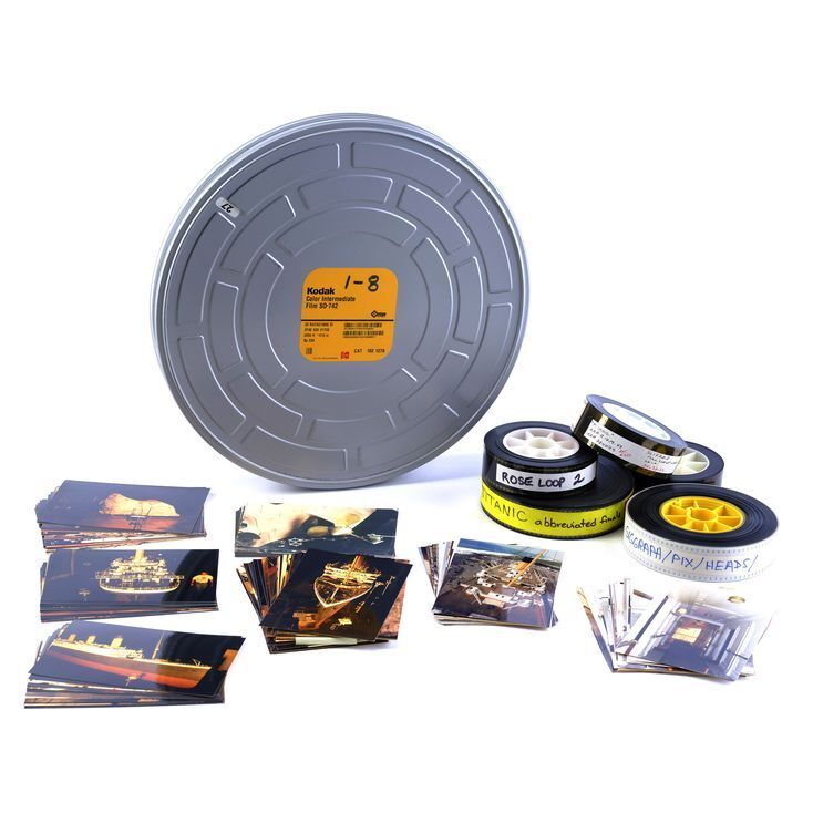 Lot # 1367: Titanic (1997) - Tin of 35mm Film Reels with Box of Continuity  and Set Photos