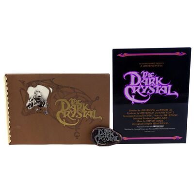 Lot # 1868: The Dark Crystal (1982) - Press Book, Program and Belt Buckle