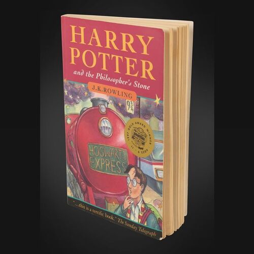 Lot #125 - HARRY POTTER AND THE PHILOSOPHER'S STONE (2001) - J.K. Rowling Autographed British Paperback Edition, 1997