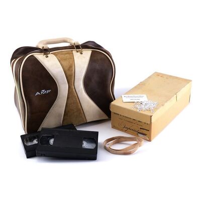 Lot # 106: Saul Goodman (as played by Bob Odenkirk) Bowling Ball Money Bag and Box of Mementos