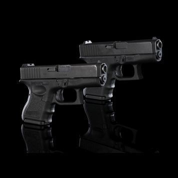 Lot # 48 : AVENGERS: AGE OF ULTRON (2015) - Pair of Black Widow's (Scarlett Johansson) Live-fire Glock 26s