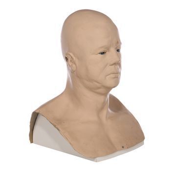 Lot # 1054 : JAMES BOND: THE LIVING DAYLIGHTS (1987) - Peter Nelson Collection: Brad Whitaker's (Joe Don Baker) Roman Emperor Statue Head and Photo