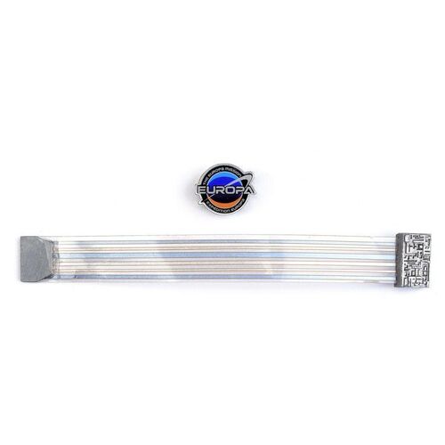 Lot # 246: Renee Picard (Penelope Mitchell) Europa Launch Gala Wristband and Europa Pin