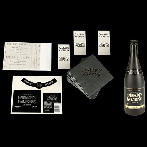 Lot #51: MARVEL'S LUKE CAGE (T.V. SERIES, 2016 - 2018) - Harlem's Paradise Stunt Champagne Bottle, Napkins, and Accessories