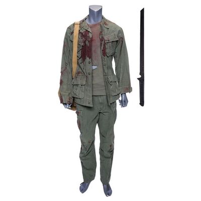 Lot #272: MARVEL'S DAREDEVIL (T.V. SERIES, 2015 - 2018) - Stick's Battle-Damaged Costume, Backpack, and Stunt Blade