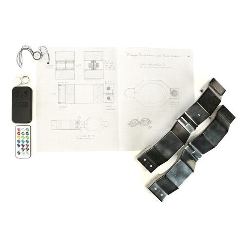 Lot #282: MARVEL'S JESSICA JONES (T.V. SERIES, 2015 - 2019) - Pair of Restraint Cuffs with Remote Controls and Concept Art
