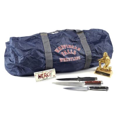 Lot #307: MARVEL'S JESSICA JONES (T.V. SERIES, 2015 - 2019) - Gregory Sallinger's Knives, Stunt Trophy, Wrestling Bag, and Bloodied 'Hero/Fraud' Bill