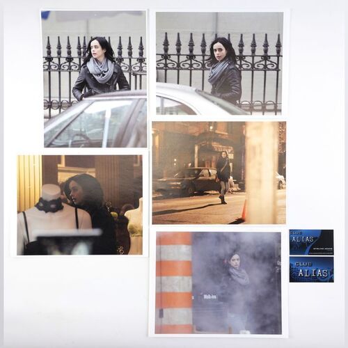 Lot #339: MARVEL'S JESSICA JONES (T.V. SERIES, 2015 - 2019) - Five Malcolm Ducasse Surveillance Photos of Jessica Jones with Two Club Alias Business Cards