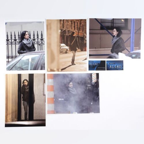 Lot #402: MARVEL'S JESSICA JONES (T.V. SERIES, 2015 - 2019) - Five Malcolm Ducasse Surveillance Photos of Jessica Jones with Two Alias Business Cards