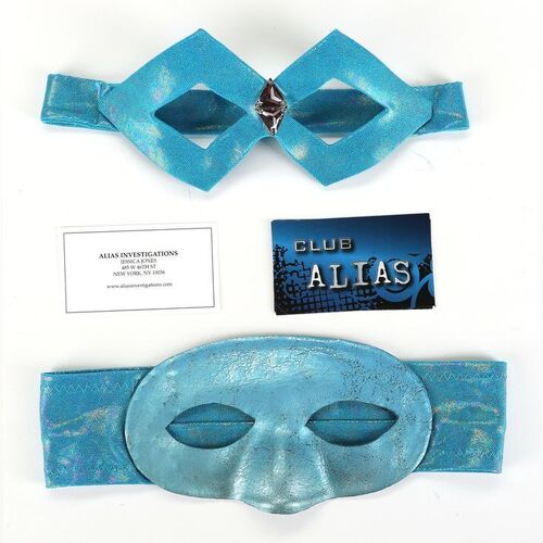 Lot #418: MARVEL'S JESSICA JONES (T.V. SERIES, 2015 - 2019) - Pair of Jessica Jones' "Jewel" Masks with Alias Investigations and Club Alias Business Cards