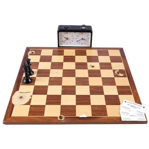 Lot #437: MARVEL'S LUKE CAGE (T.V. SERIES, 2016 - 2018) - Pop's Bullet-Riddled Chessboard with Clock, Chess Pieces and James Lucas Business Cards