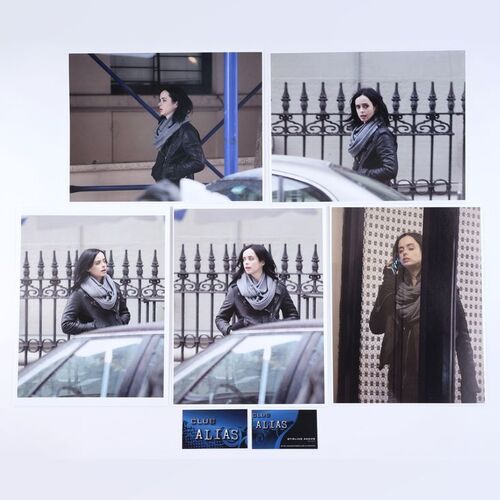 Lot #458: MARVEL'S JESSICA JONES (T.V. SERIES, 2015 - 2019) - Five Malcom Ducasse Surveillance Photos of Jessica Jones with Two Club Alias Business Cards