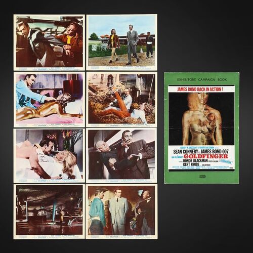 Lot #185 - JAMES BOND: GOLDFINGER (1964) - Complete Set of Eight British Front of House Lobby Cards and Exhibitors' Campaign Book, 1964