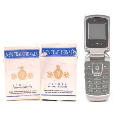 Lot # 139: BREAKING BAD (T.V. SERIES, 2008 - 2013) - Jesse Pinkman's (Aaron Paul) Cellphone and Skyler White's (Anna Gunn) New Traditionals Cartons