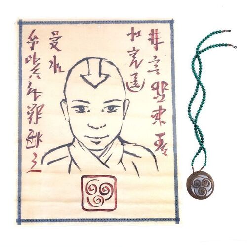 Lot # 465: LAST AIRBENDER, THE (2010) - Aang (Noah Ringer) Wanted Poster and Monk Gyatso's (Damon Gupton) Amulet
