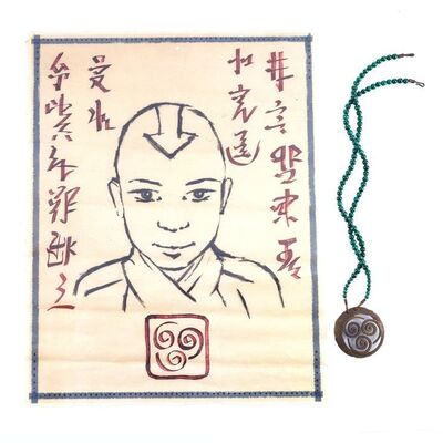 Lot # 465: LAST AIRBENDER, THE (2010) - Aang (Noah Ringer) Wanted Poster and Monk Gyatso's (Damon Gupton) Amulet