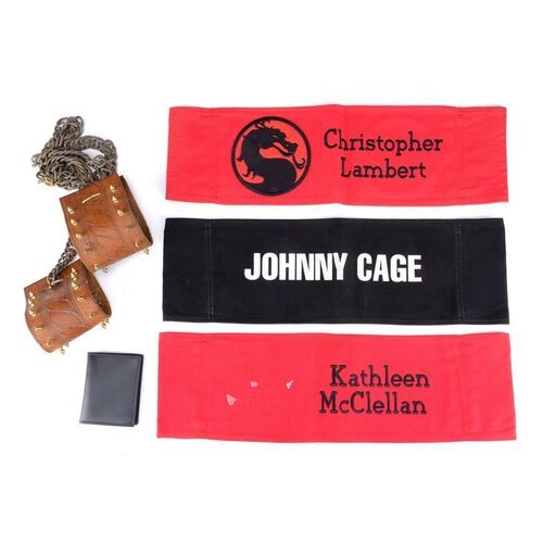 Lot # 536: MORTAL KOMBAT (1995) - Sonya Blade's (Bridgette Wilson) Cuffs and Wallet, Johnny Cage's (Linden Ashby) Chair Back, and Production-Made Chair Backs