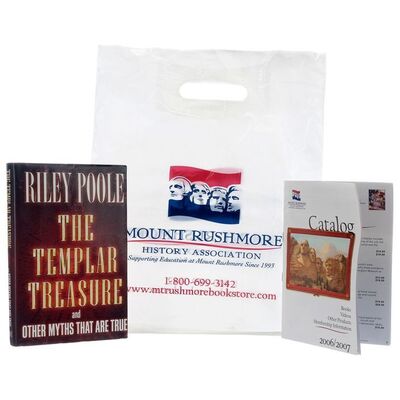 Lot # 550: NATIONAL TREASURE: BOOK OF SECRETS (2007) - "The Templar Treasure" Book with Mount Rushmore Catalog and Bag