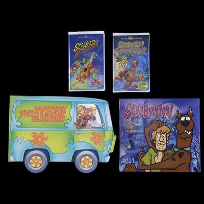 Lot # 17: Scooby-Doo 1997 Style Guide, Calendar with Alien Invaders and the Witch's Ghost VHS Tapes