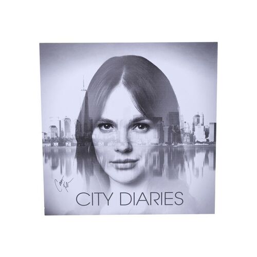 Lot #54: Tessa Porter's (as played by Cait Fairbanks) Signed "City Diaries" Album Cover
