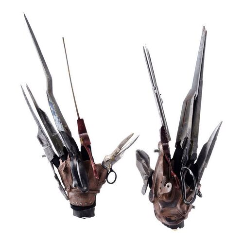 Lot #123 - Edward Scissorhands' (Johnny Depp) Scissor Hand Set with Screen-Matched Retractable Blades ### EDWARD SCISSORHANDS (1990)